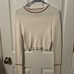 Cream long sleeve crop top.